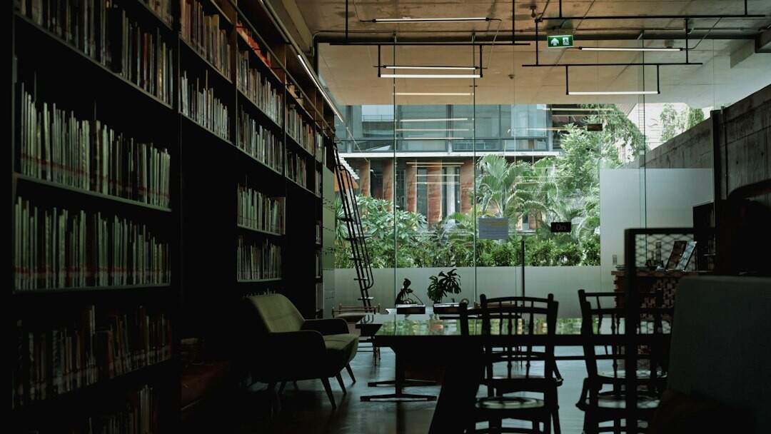 Calm editorial office interior with wooden desk and shelved journals